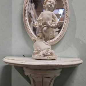 Mensola, specchio e puttino